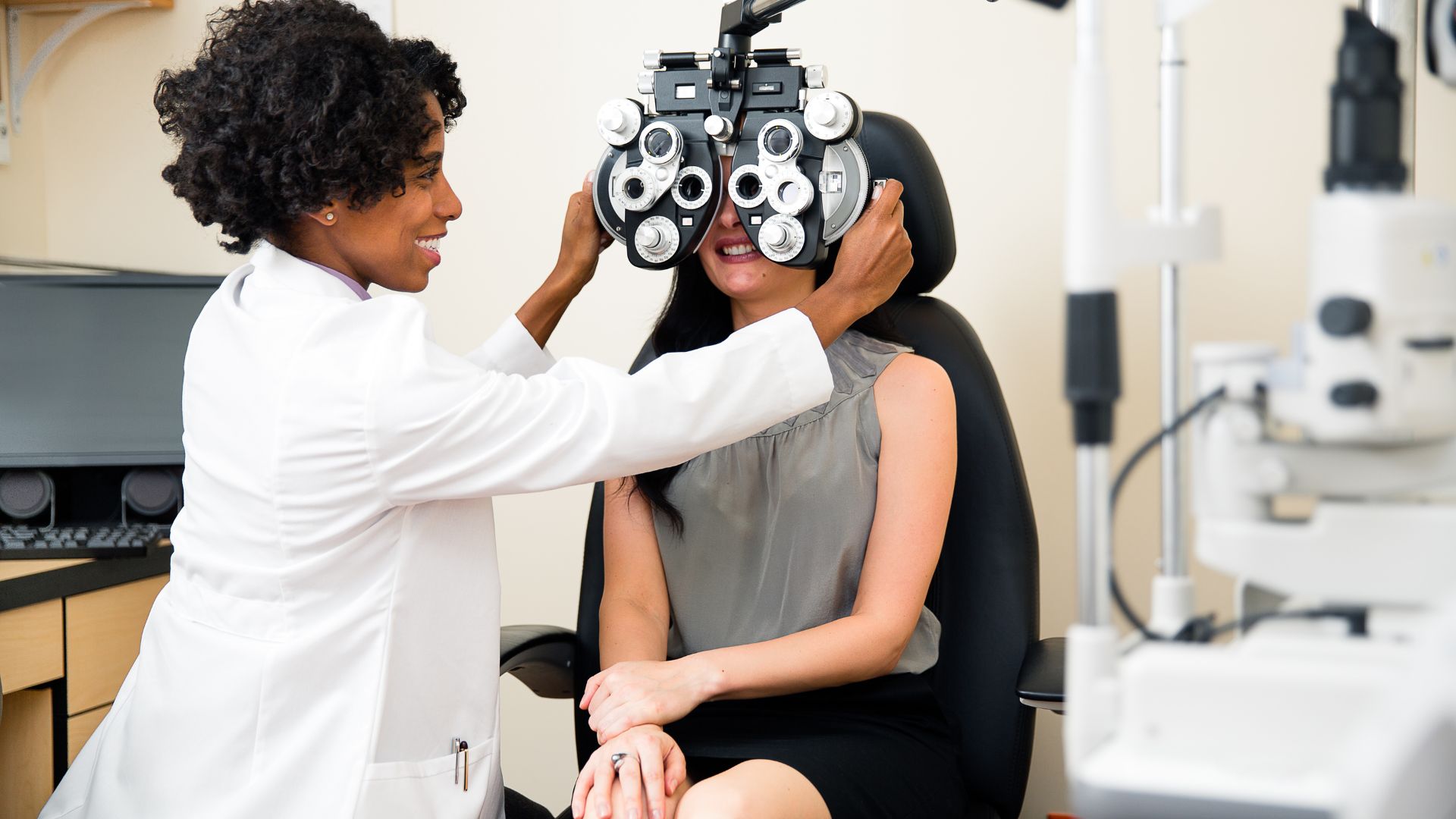 doctor checking eyes of girl