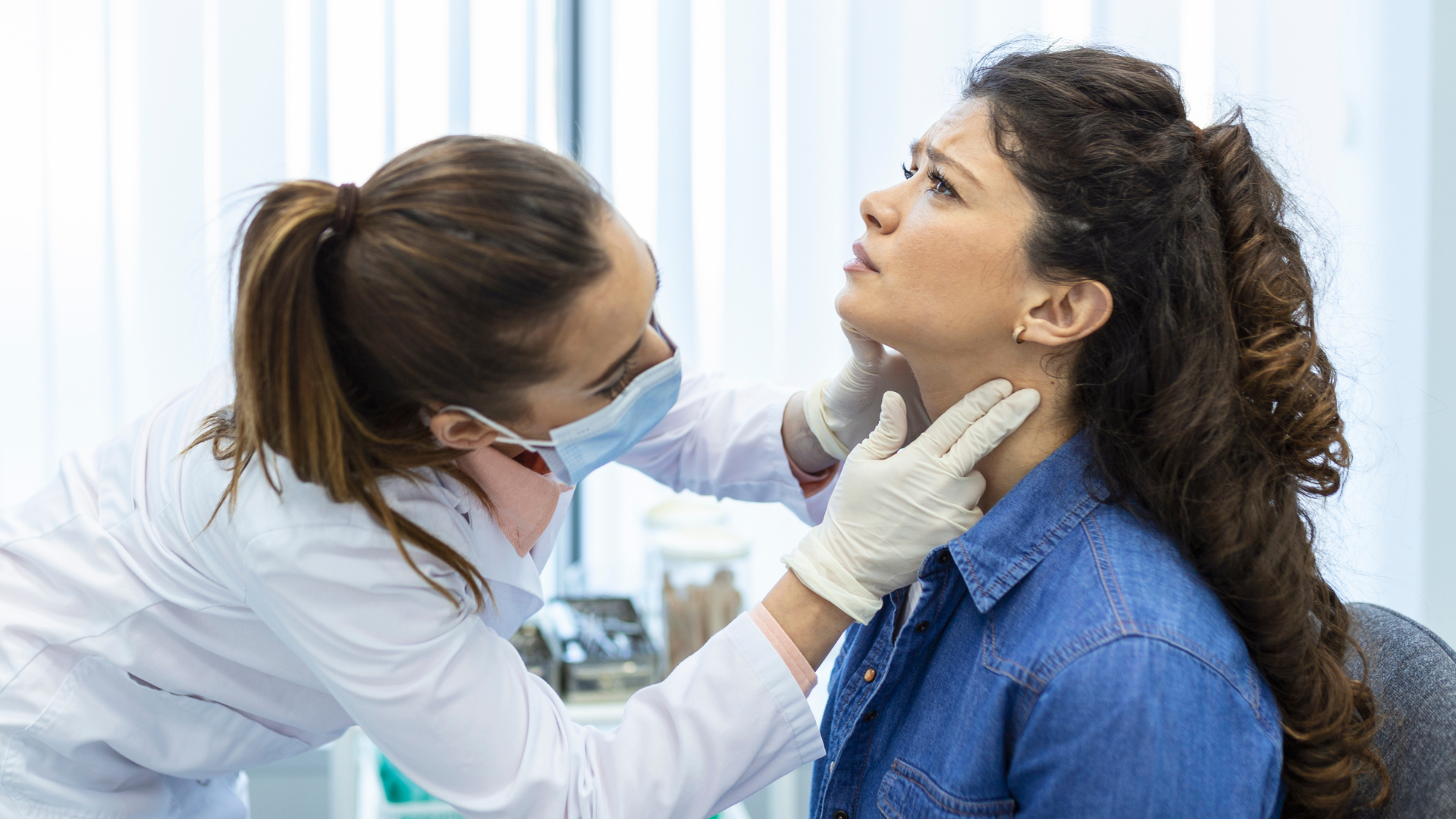 endocrinologist-examining-throat-young-woman-clinic-women-with-thyroid-gland-test-endocrinology-hormones-treatment-inflammation-sore-throat